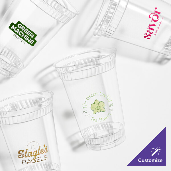 A group of clear Fabri-Kal Greenware plastic cups.