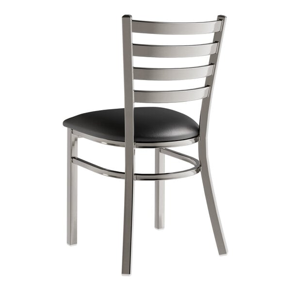 A Lancaster Table & Seating metal chair with a black vinyl padded seat.