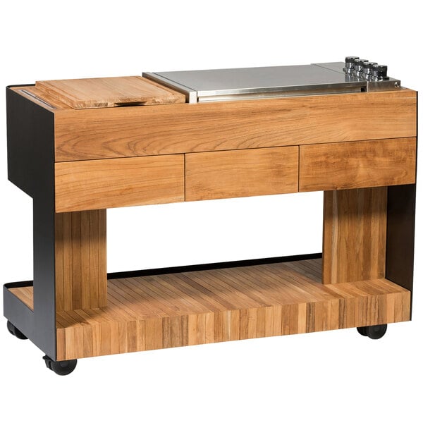An Astella Indu+ outdoor mobile bistro island with a stainless steel top and wood accents.