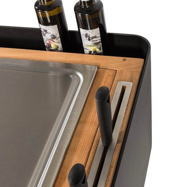 A stainless steel Astella Bistro Island with two bottles of wine on the counter.