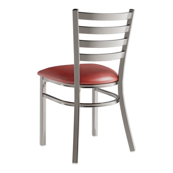 A Lancaster Table & Seating metal restaurant chair with a burgundy vinyl seat and back.