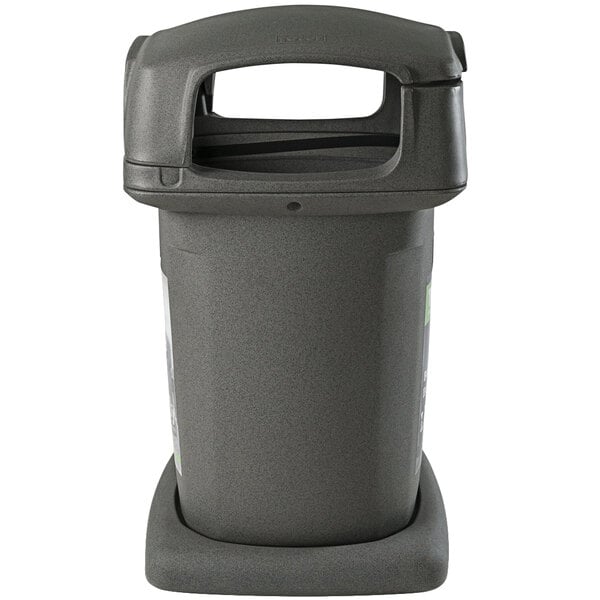 A gray trash can with a black lid.