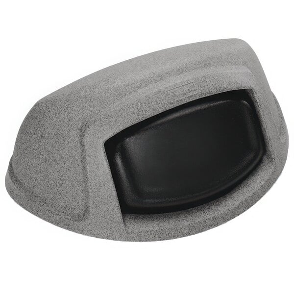 A Toter grey half round dome lid with black push-in door on a grey surface.