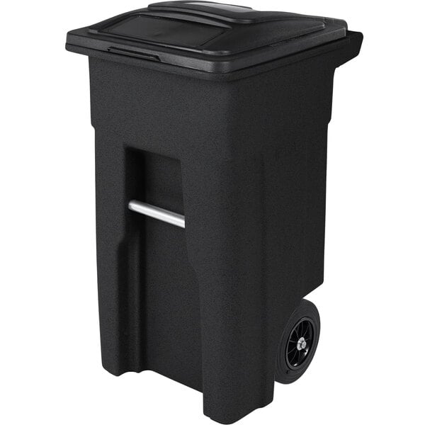 A black Toter rectangular trash can with wheels and a lid.