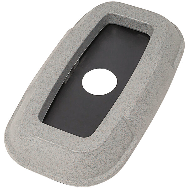A grey rectangular plastic lid with a hole in the middle.
