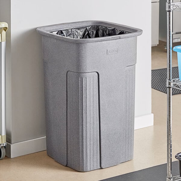 a grey plastic trash can
