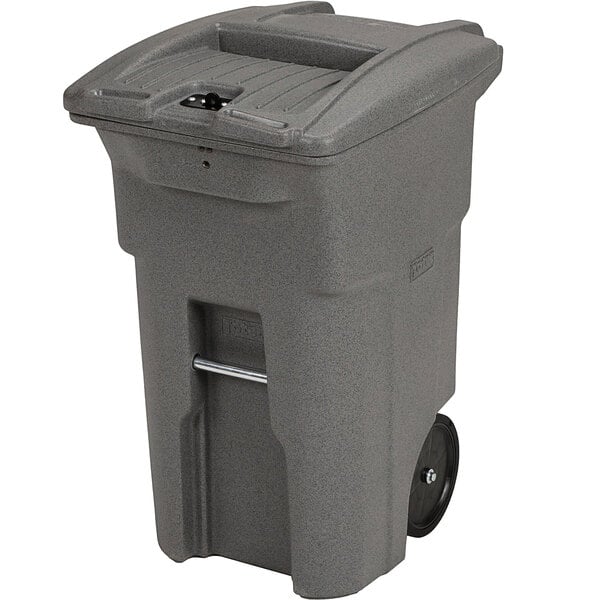 A grey Toter commercial trash can with wheels.