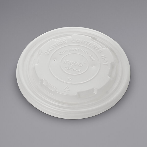 A white plastic Fineline lid with text on it.