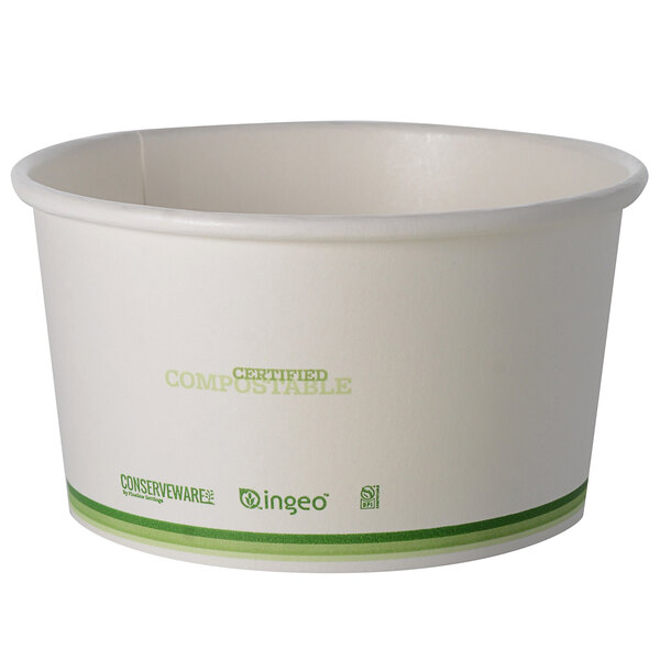 A white bowl with green trim.