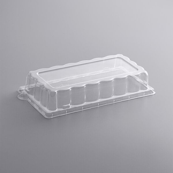 A clear Fineline PETE dome lid on a clear plastic container.