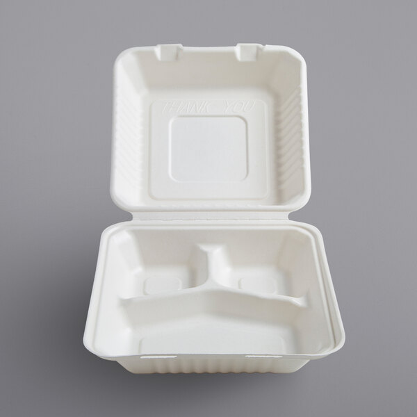 A white bagasse take-out container with three compartments.