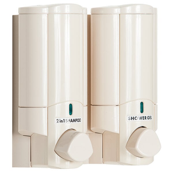 Two white Dispenser Amenities Aviva shower dispensers on a wall.