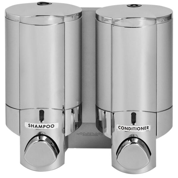 A chrome Dispenser Amenities Aviva 2-chamber wall mounted shower dispenser with satin silver bottles.