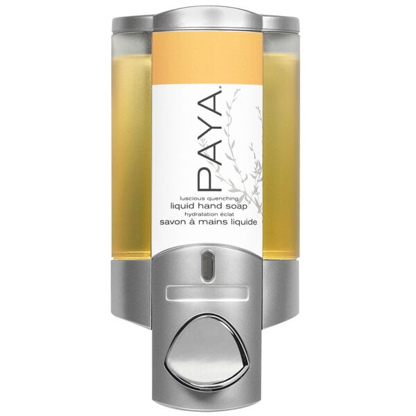 A wall mounted satin silver Dispenser Amenities soap dispenser with a translucent bottle and Paya label filled with liquid soap.