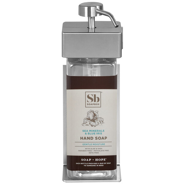 A white ABS plastic wall mounted shower soap dispenser with a rectangular bottle of soap with a Soapbox label inside.