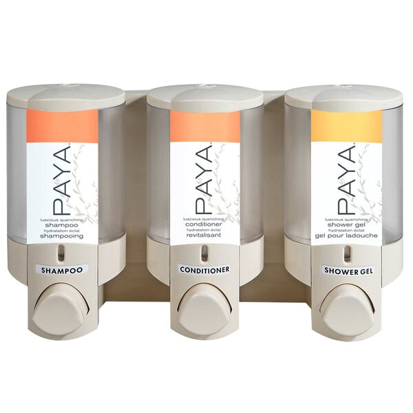 A white Dispenser Amenities Aviva wall mounted soap dispenser with three translucent bottles.