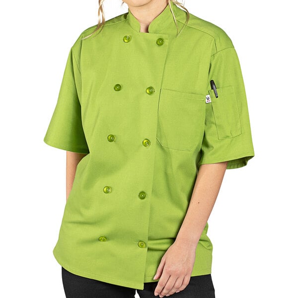 A person wearing a green Uncommon Chef avocado print chef coat.