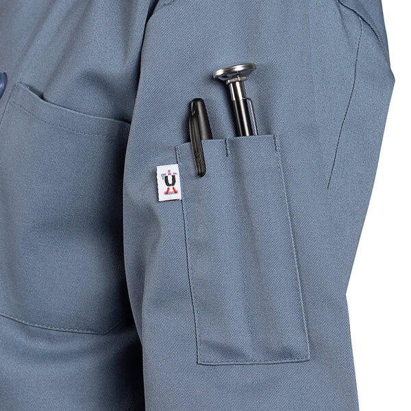 A steel blue short sleeve chef coat with a pocket.