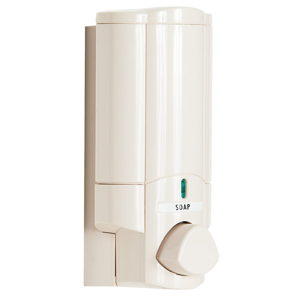 A white wall-mounted round soap dispenser with a Beekman label.