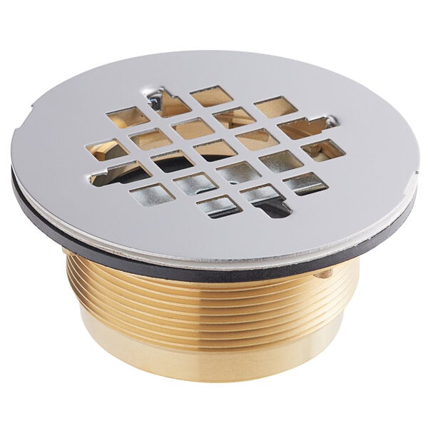 A Regency mop sink drain assembly with a metal grid cover.