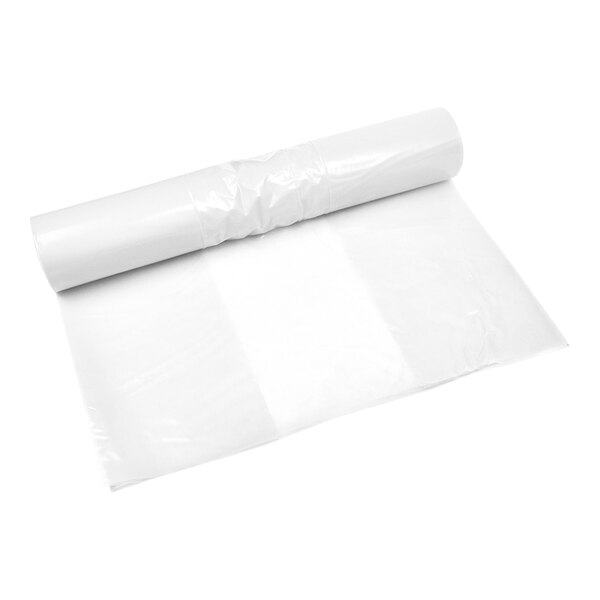 A roll of transparent plastic bags with one bag partially unrolled.