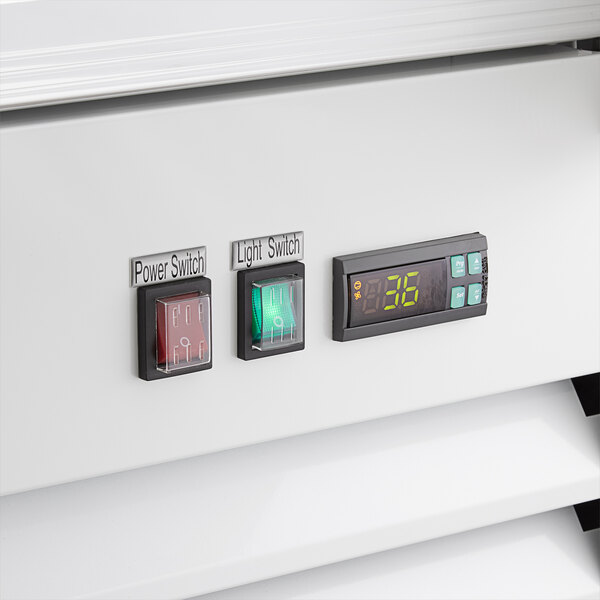 The electronic control panel on a white Avantco ice merchandiser.