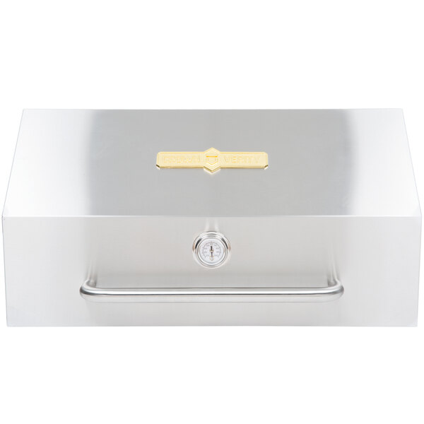 A silver stainless steel box with a gold handle.