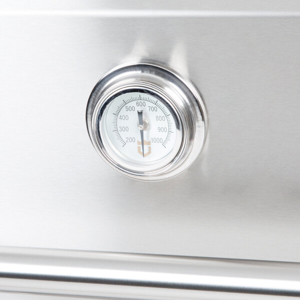 A stainless steel Crown Verity roll dome cover with a temperature gauge.