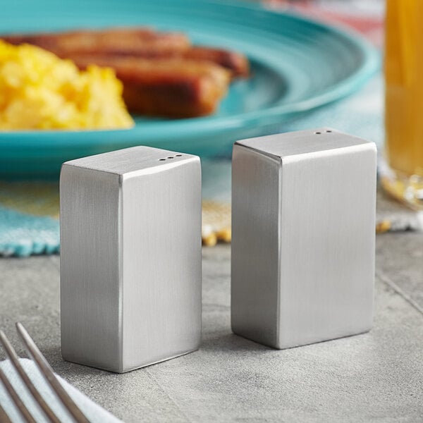 A silver rectangular American Metalcraft salt and pepper shaker set on a table.