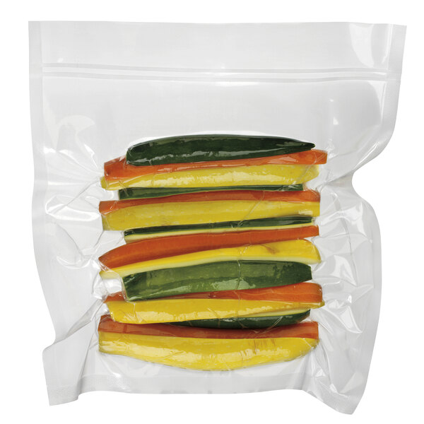 A plastic bag of yellow and green vegetables.