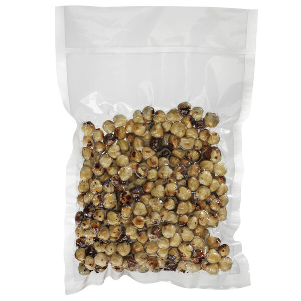 A plastic bag of food with Hamilton Beach vacuum packaging pouches inside.