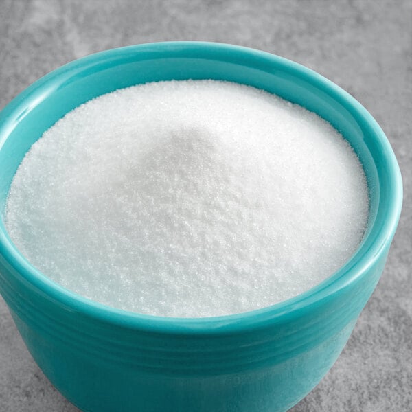 A bowl of white powder on a table.