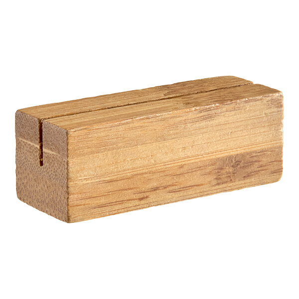 A close-up of a wooden block with a hole in the middle.