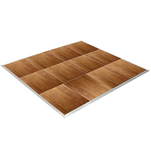 A Palmer Snyder American Plank Vinyl Portable Dance Floor with silver trim. White lines on a wooden floor.