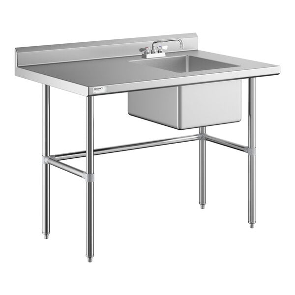 A stainless steel work table with a right-side sink, faucet, and cross-braced legs.