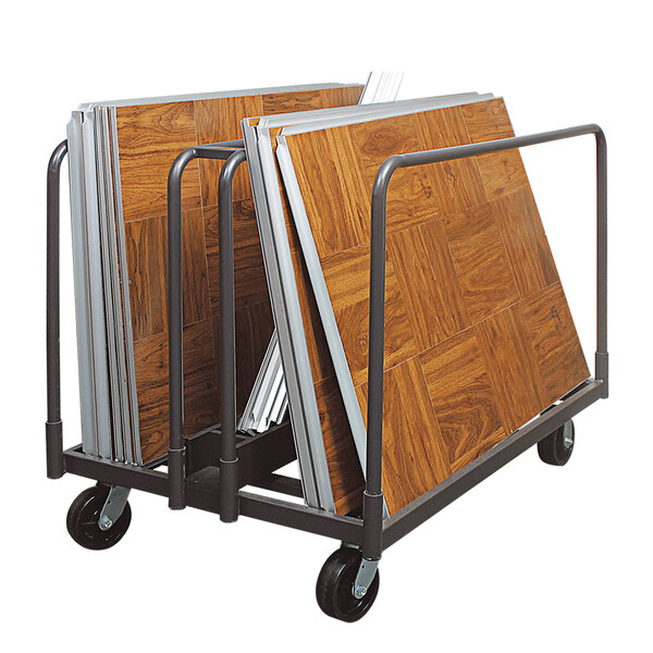 A Palmer Snyder steel transport cart for portable dance floors with wooden flooring on it.