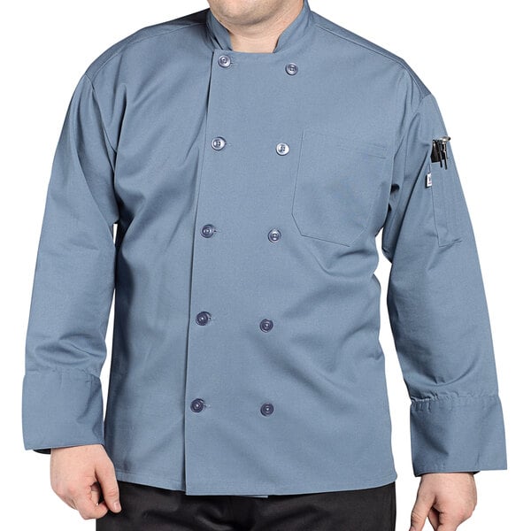 A man wearing an Uncommon Chef Orleans long sleeve chef coat.