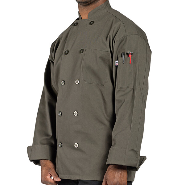 A man wearing a Uncommon Chef Orleans olive long sleeve chef coat.