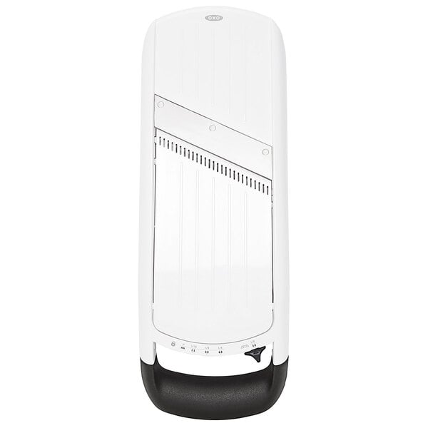 An OXO mandoline slicer with a white panel and black handle.