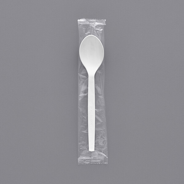 An Eco-Products renewable plant starch spoon individually wrapped in a plastic bag with a white strip.