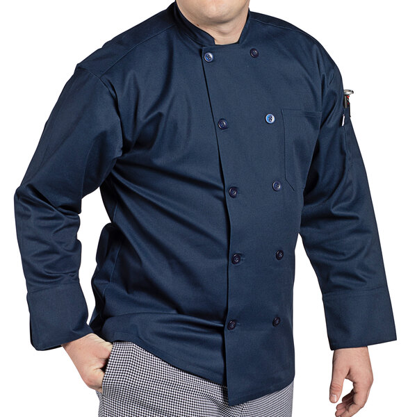 A man wearing a navy Uncommon Chef long sleeve chef coat.