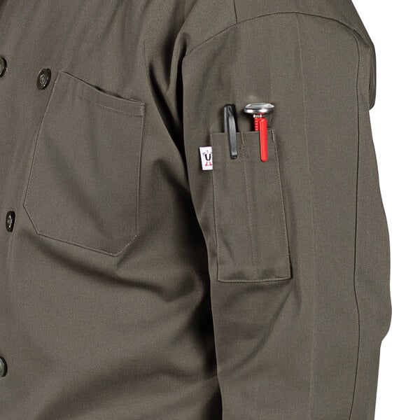 A person wearing an Uncommon Chef olive green long sleeve chef coat with pockets and buttons.