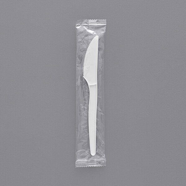 a white object with a black handle