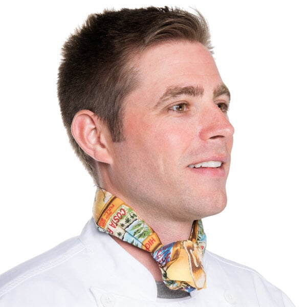 A man wearing an Intedge chef neckerchief with a colorful coffee and tea pattern.