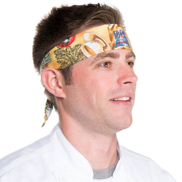 A man wearing an Intedge Coffee & Tea patterned chef bandana.