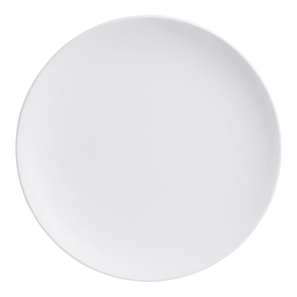 A plain, round, white plate with a smooth matte finish.