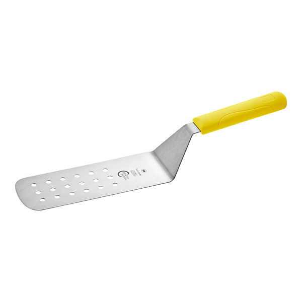 A Mercer Culinary Millennia perforated turner with a yellow handle.