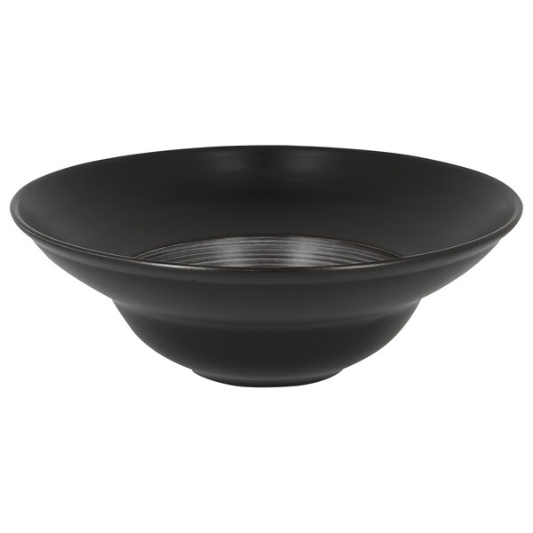 A grey and black wide rim porcelain plate with a white background.