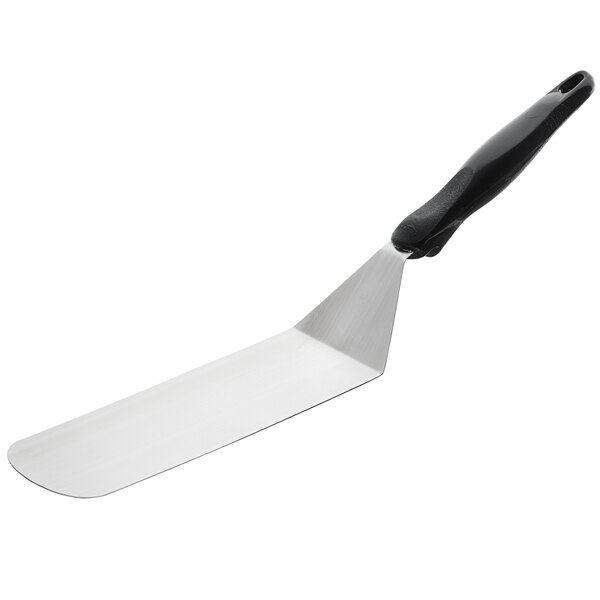 a spatula with a black handle