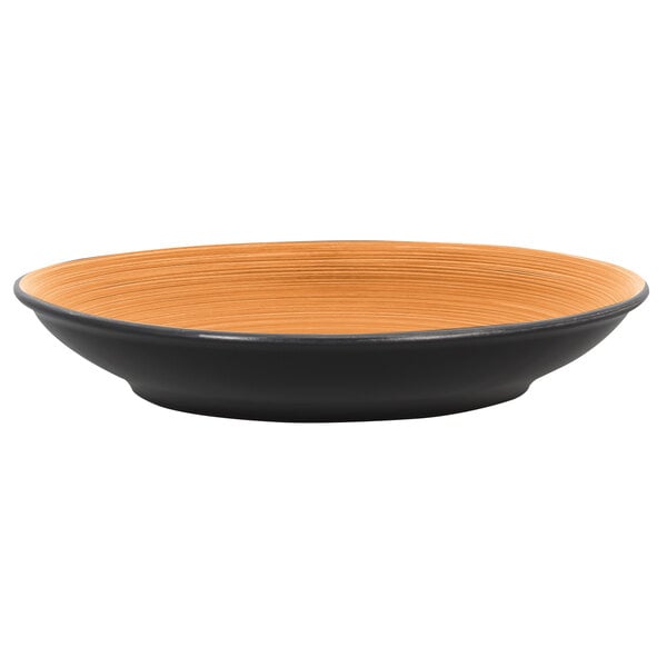 A black and cedar RAK Porcelain Trinidad deep coupe plate.